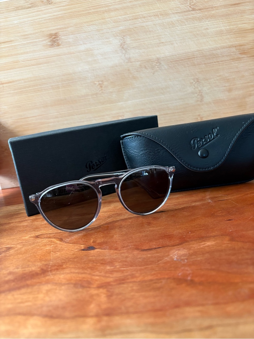 Persol Men’s Transparent Gray Round Sunglasses with Dark Lenses